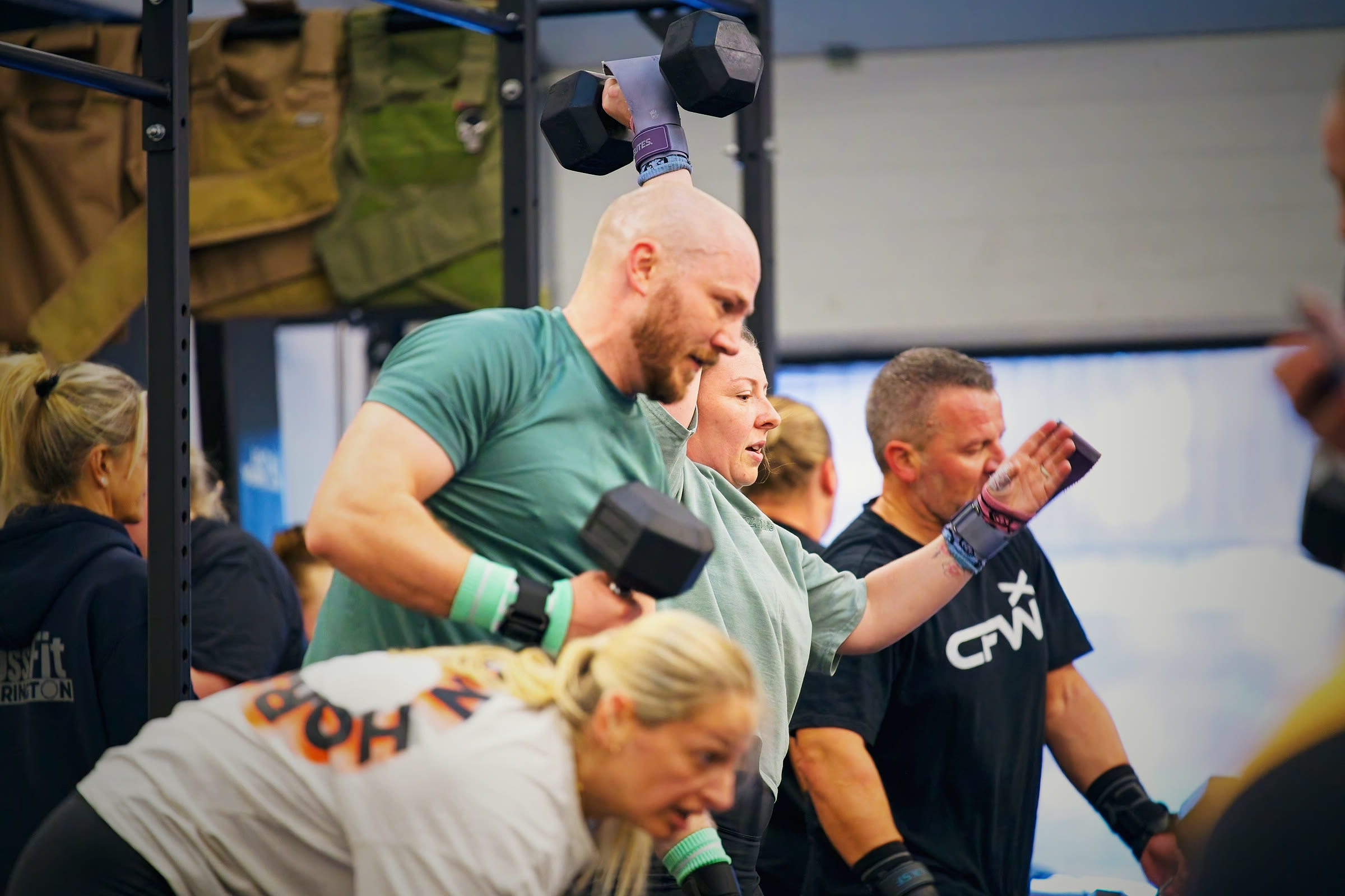 CrossFit Warrington members high-fiving and cheering each other on