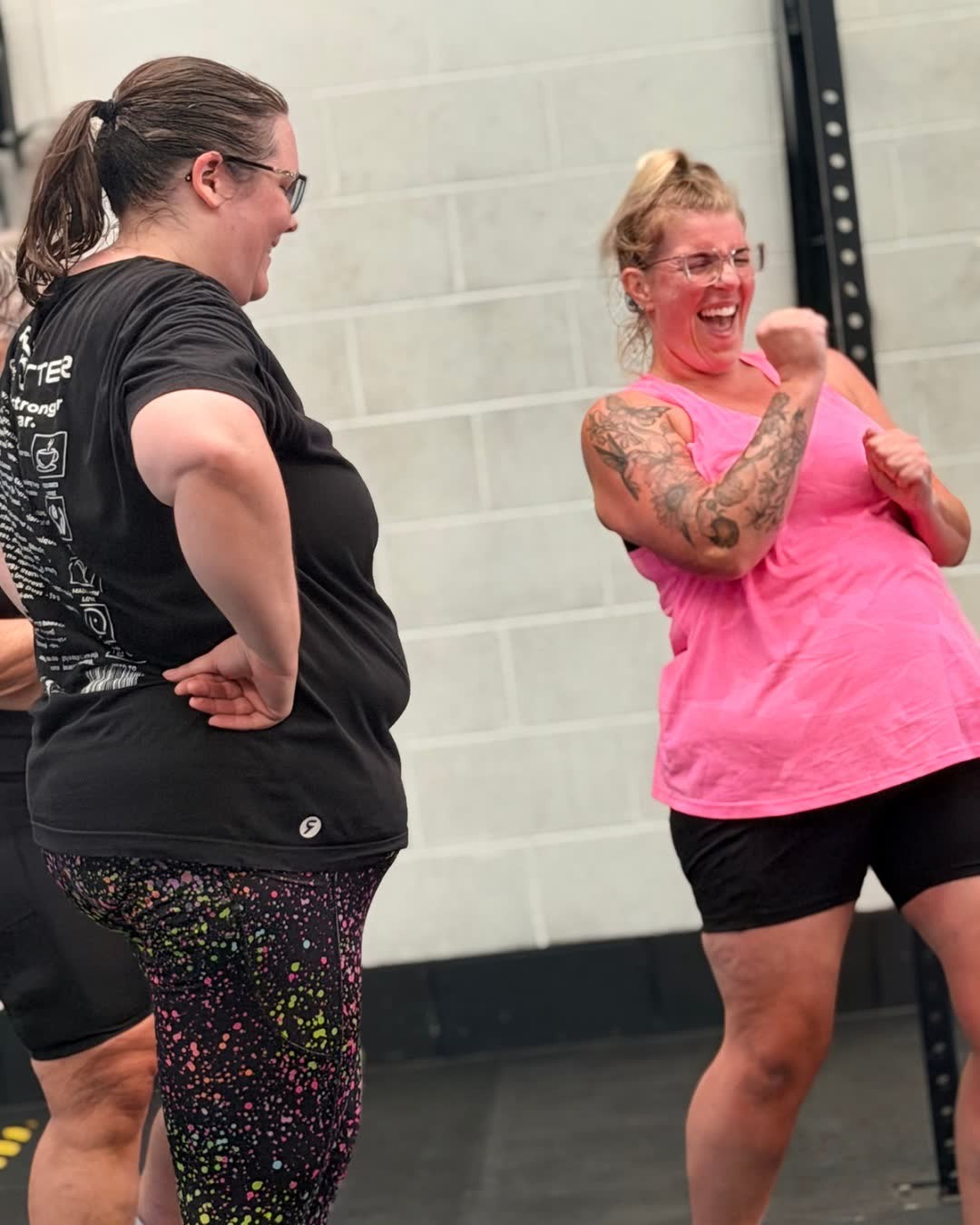 Two members laughing between exercises at CrossFit Warrington